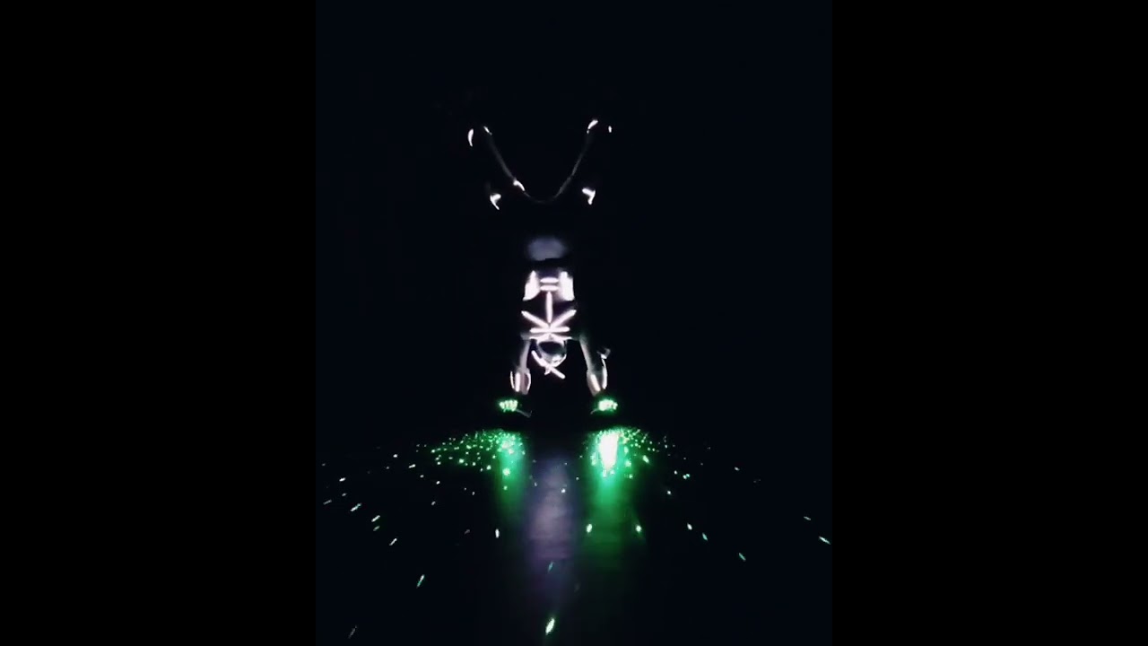 Handstand on electric skates with laser gloves