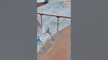 Video of unloading phosphate rock from ships with decompression. Original video, no copying allowed