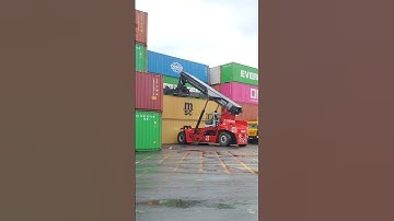 Kalmar Reach stacker with a tilting spreader for container handling