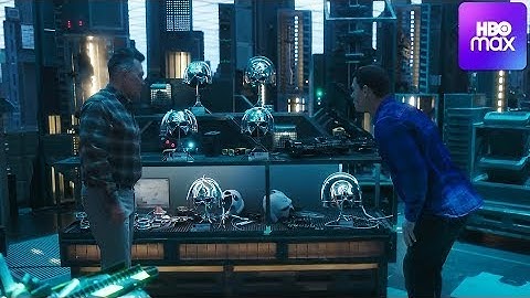 Peacemaker looks at different Helmets in his father