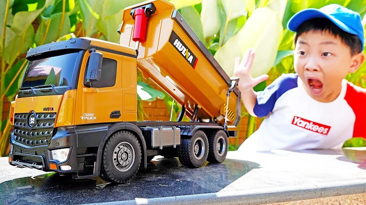 Yejun tests toy trucks and excavators at playground