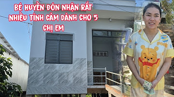 Bé  Huyền vui mừng vì tình thương của ông ,bà ,cô ,chú dành cho 5 chị ,em quá nhiều .