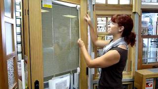 Laura demonstrates the between-glass blinds door window from eagle
windows.
