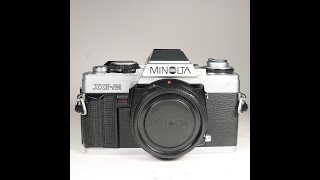 Minolta XG-M 35mm Film SLR Camera Body being checked over for condition