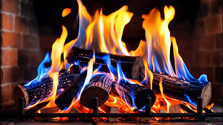 Fireplace With Color-changing Blue And Orange Flames, Brick Wall Background For Cozy Atmosphere
