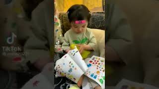Cute baby Girl applying stickers all over the dog | Kids mischief video screenshot 3