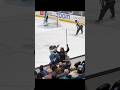Yonex Jones tries taking a picture with San Jose Sharky