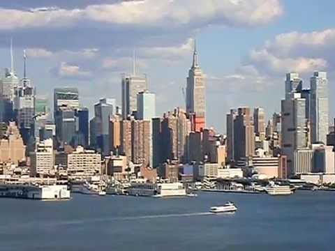 June 2010. As seen from the Palisades in New Jersey. (in order of appearance) Downtown Jersey City, the Hudson River/Verrazano Bridge, Downtown Manhattan, Mi...