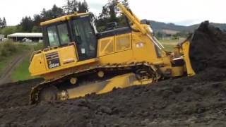 Komatsu d65 Dozer pushing uphill