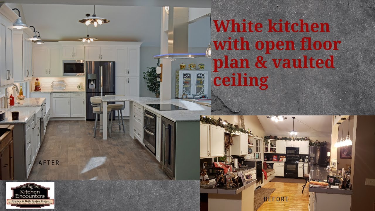 White Kitchen With Open Floor Plan Vaulted Ceiling And Stainless