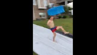 Guy Flew Off A Board Going Fast On A Slip And Slide