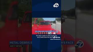 Metal debris flies through windshield, barely misses driver