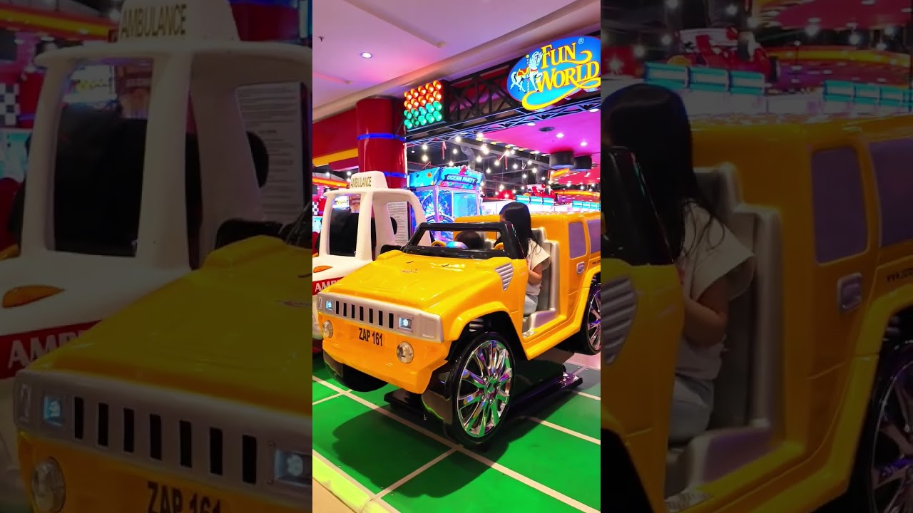 Giera Riding a Yellow Toy Jeep