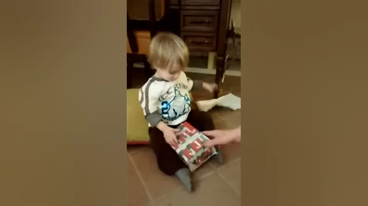 Charlie opening a present.