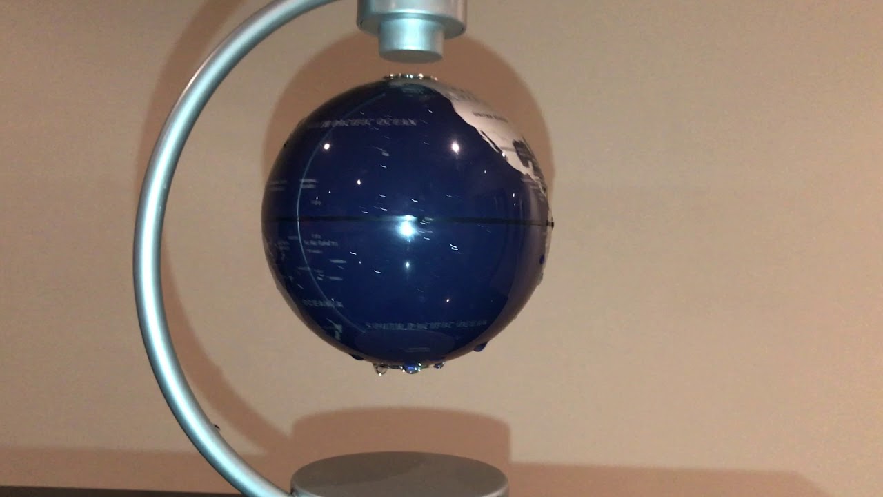 Show me water sticking to the bottom of a spinning ball... Sure, No