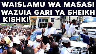 SHEIKH KISHKI'S CAR IS BANISHED AS CROWDS OF BELIEVERS COME ONTO THE WINDOW OF THE CAR, SHEIKH WA...