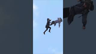 Kung Fu hero kicks the assassin into mountain with his flying serial legs in the sky