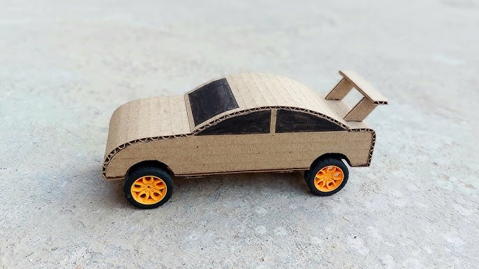 Une voiture en papier - Paperblog  Voiture en carton, Maquette en carton,  Modèles en papier