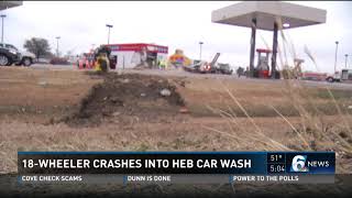 18-wheeler crashes into HEB car wash