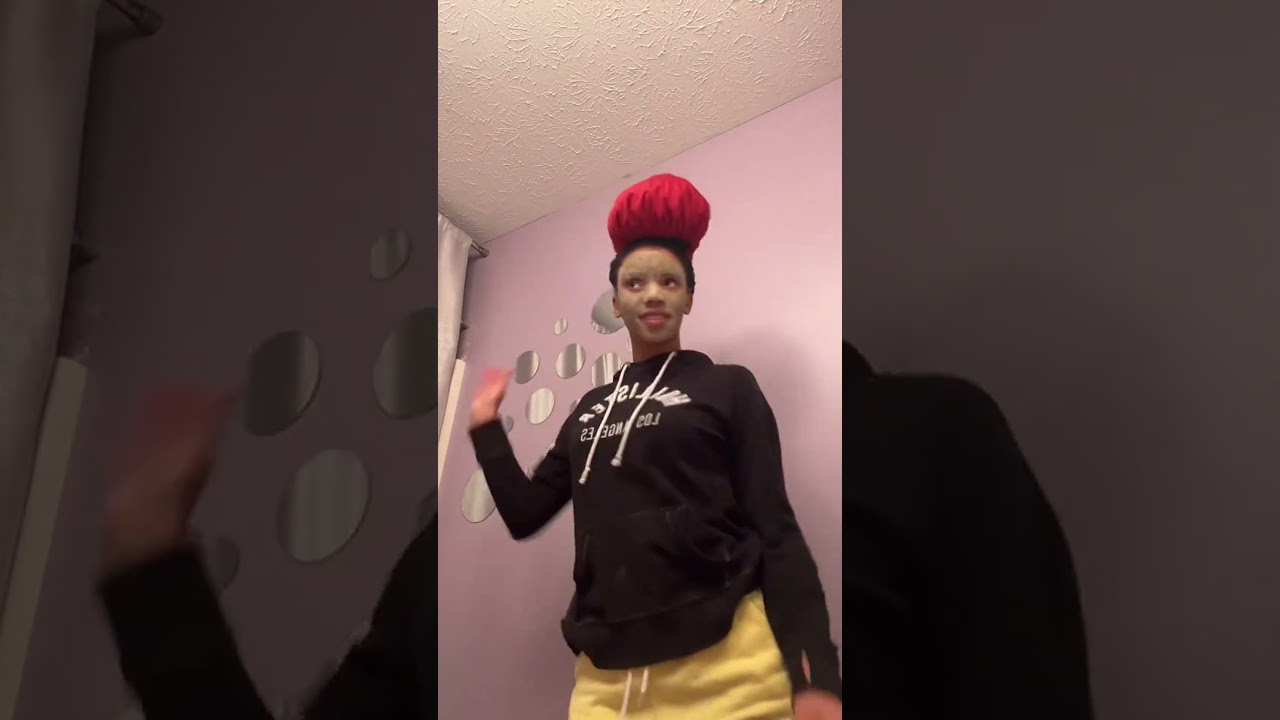 Funky Fresh Vibe: Woman Grooves to Music with a Green Face Mask