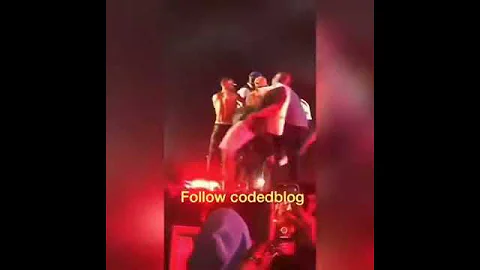 Wizkid falls on stage while been held by a fan