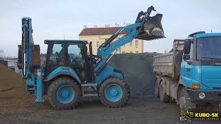 CAT 444F2 backhoe loading TATRA Terrno1 truck