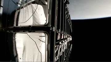 SpaceX rocket upper stage seen in reflection during Starlink deployment