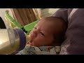 Baby tries bottle feeding for the first time