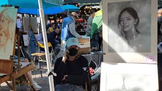 A walk inside the famous square: Place du Tertre and its painters in Montmartre district of Paris.