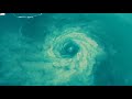 Drone captures incredible swirling rip at Manly Beach