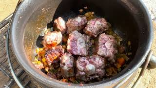 Wood Fire Oxtail Potjie with Porter Beer Slow Cook