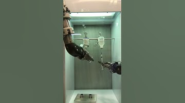 Dispensing FDG drug using a robotic arm.