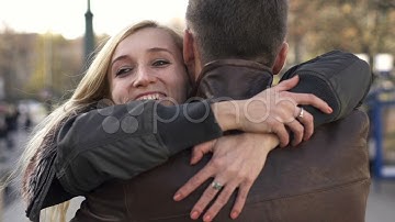Happy couple hugging in the city, slow motion, shot at 240fps HD. Stock Footage