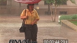6/27/2005 news b-roll video of people caught out in heavy rain. the
rain st. paul mn. with inside umbrellas...