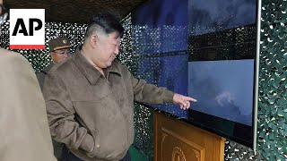 North Korean state media shows Kim Jong Un watching rocket launches