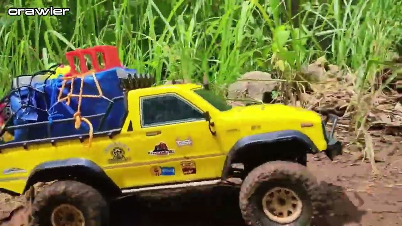 Pickup truck jeep carrying heavy loads through extreme terrain in the forest,rc car crawling