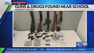 12 guns, drugs, cash found next to Marion County school