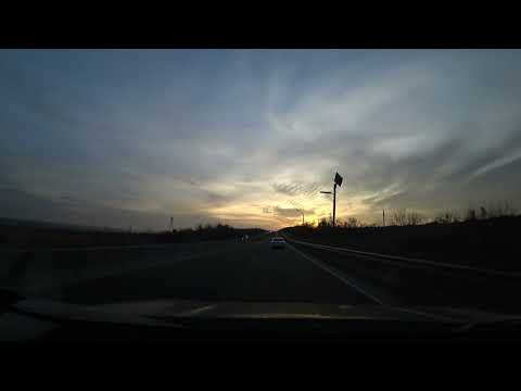 На машине от