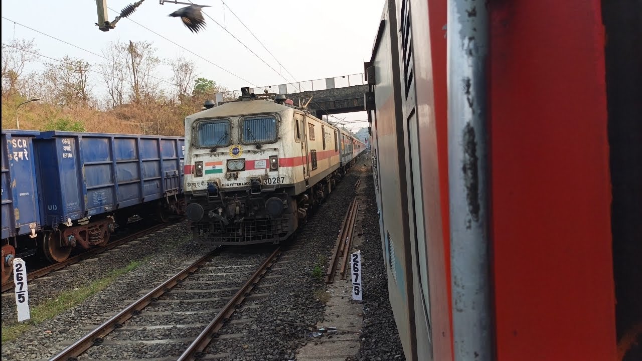 11100 Mumbai LTT Express 🔥 Crossing 10103 Mandovi Express At Rajapur Railway Station.