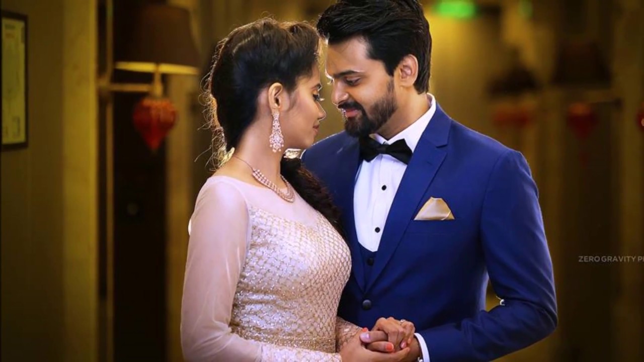 Photo of Couple posing with pretty decor with bride wearing cape lehenga