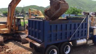 Excavator Loads Up Peterbilt Dump Truck