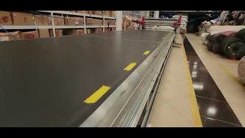 Hệ thống trải, cắt vải tự động với bàn trải vải băng tải dài 25m