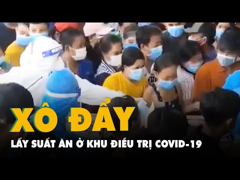 Xô đẩy lấy suất ăn trong khu điều trị dã chiến ở Bình Dương