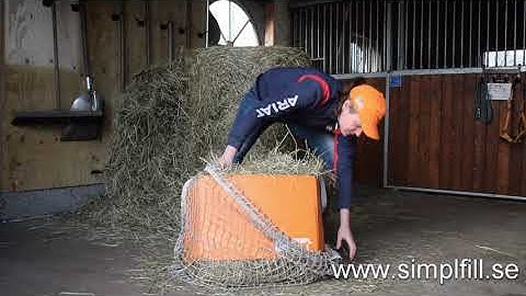 Filling a hay net with the use of Simplfill