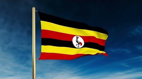 4K Uganda flag slider style. Waving in the wind with cloud background animation Stock video