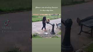 Woman uses drinking fountain to clean dogs bum. Revolting