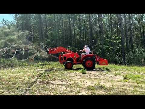 Practicing using the grapple with my new Kubota L2502 tractor