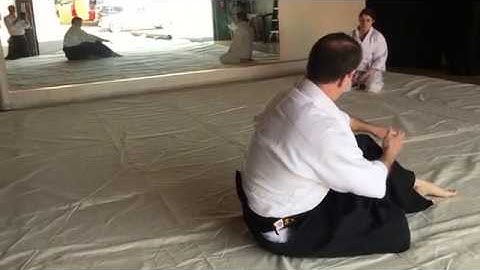 How to do an Aikido backward roll (ushiro ukemi) from sitting