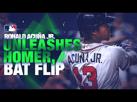 Acuna flips his bat after a booming over off Urena