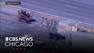 I-65 reopens after U.S. mail trailer crashes, splits open